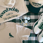 Golf-themed clothing and accessories on a checkered tablecloth