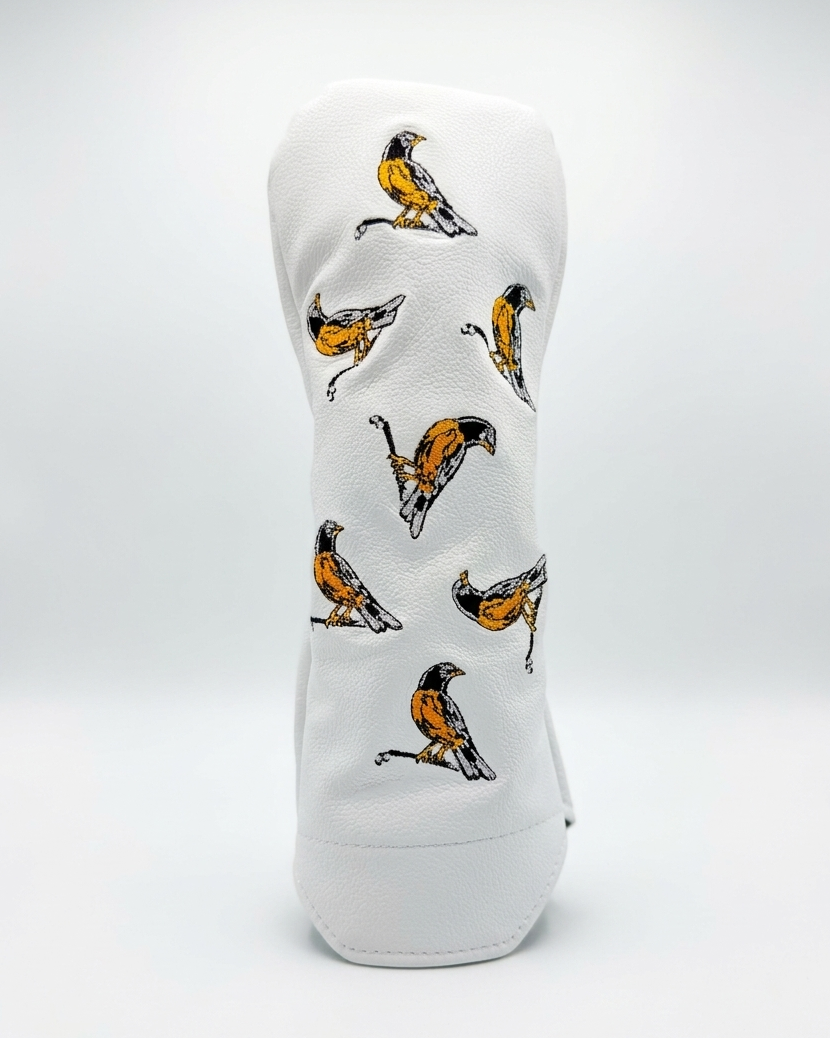 White golf head cover with bird pattern on a white background