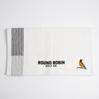 White golf towel with black stripes and 'Round Robin Golf Co.' logo on a white background